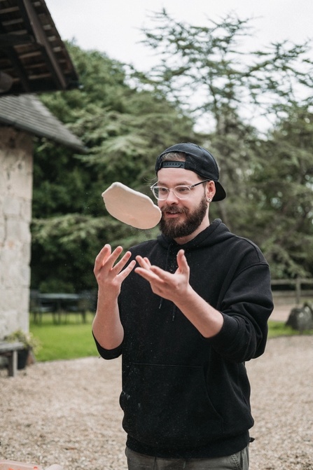 Richard throwing pizza dough