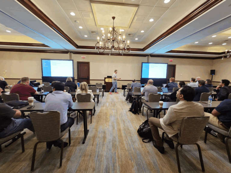 Conference attendees watching a presentation at Kscope25.