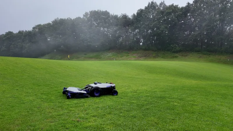 PANDAG G1 performing autonomous mowing on a golf course