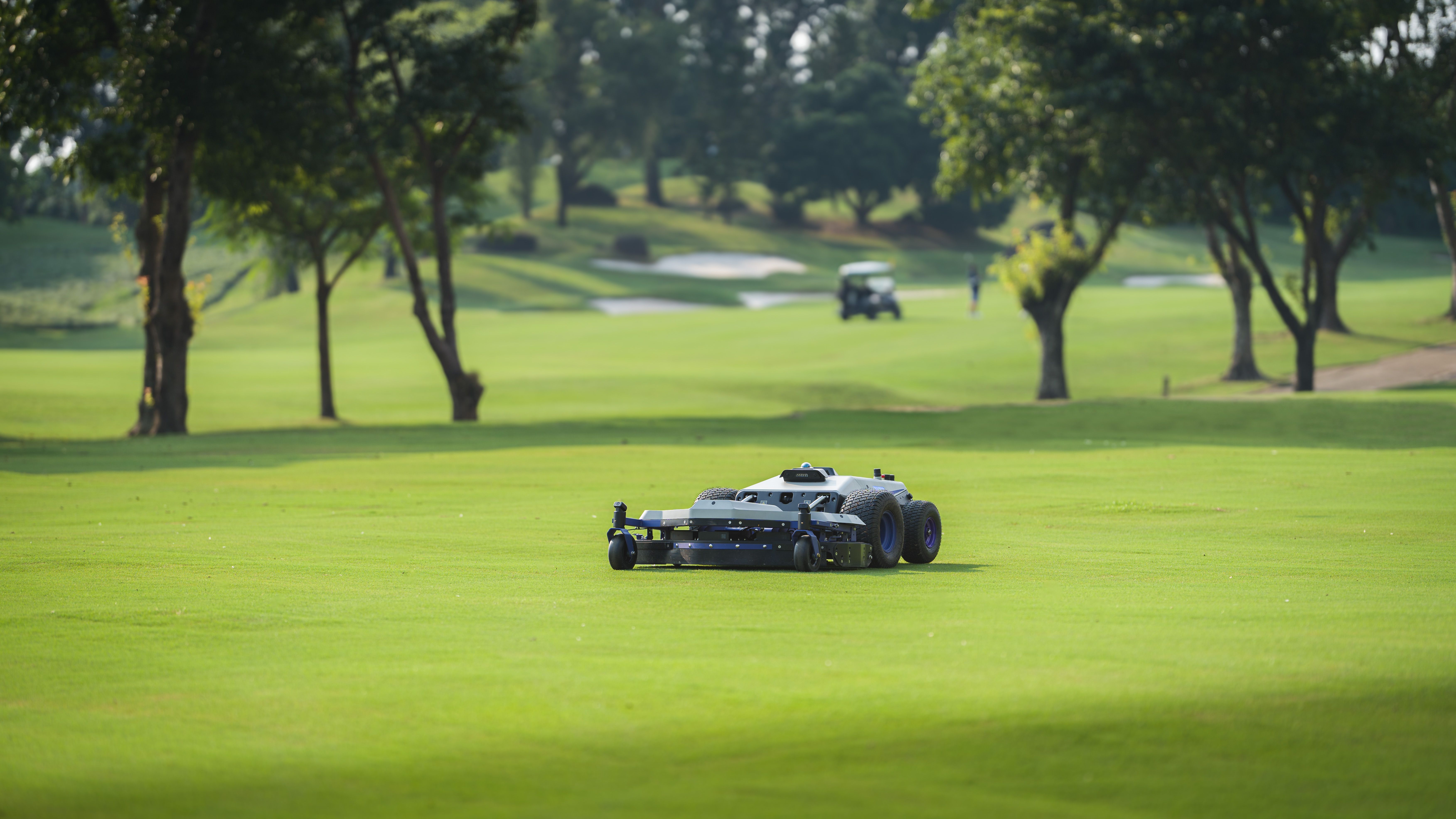 PANDAG G1 robotic mower working on golf course grounds during daily maintenance