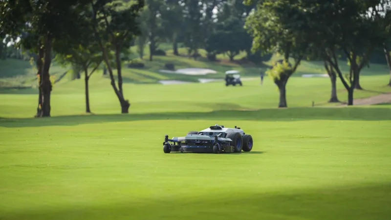 Commercial robotic mower PANDAG G1 mowing grass on a golf course