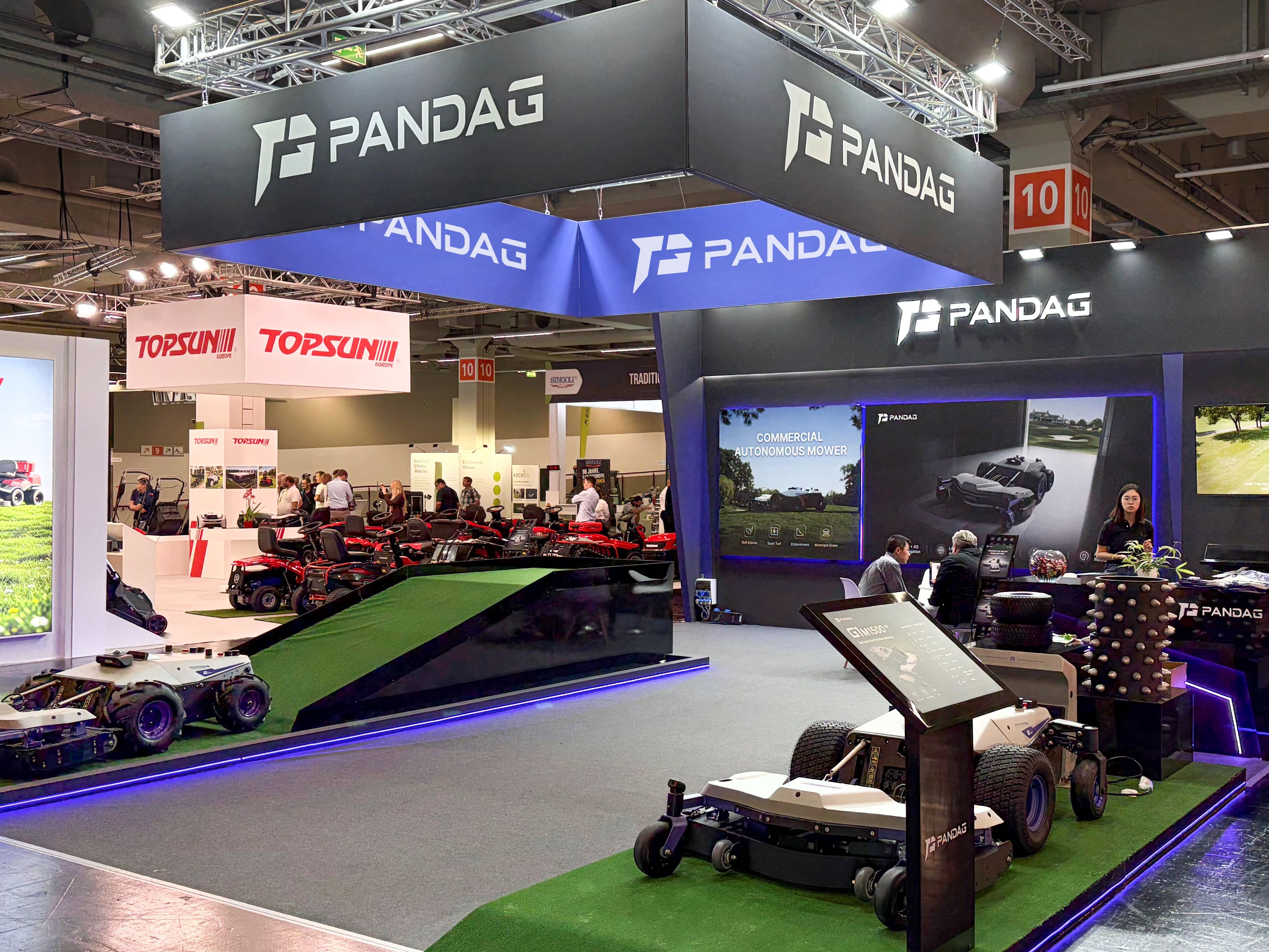 PANDAG G1 commercial robotic mower displayed at the exhibition booth