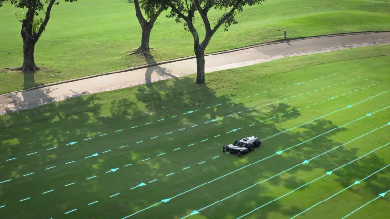 PANDAG G1 commercial robotic mower mowing rough areas on a golf course