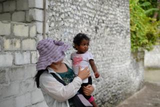 Woman and child on a Maldives island