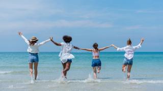 Teenagers playing in the ocean