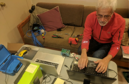 Val working on the Orcanode software and hardware.