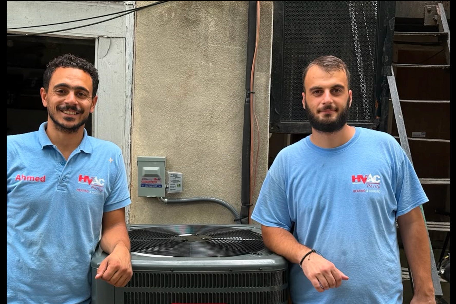 Newly installed outdoor AC condenser on a concrete pad
