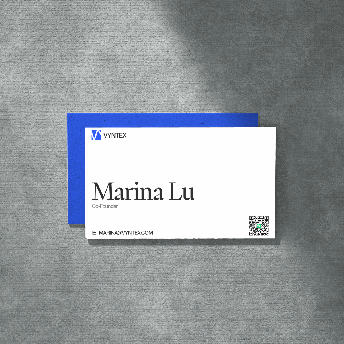VYNTEX business cards designed by VX.STUDIO, featuring the logo in the brand’s blue palette.