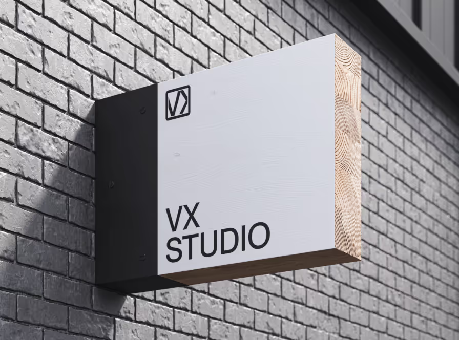 VX STUDIO sign with the VX logo on a white brick wall