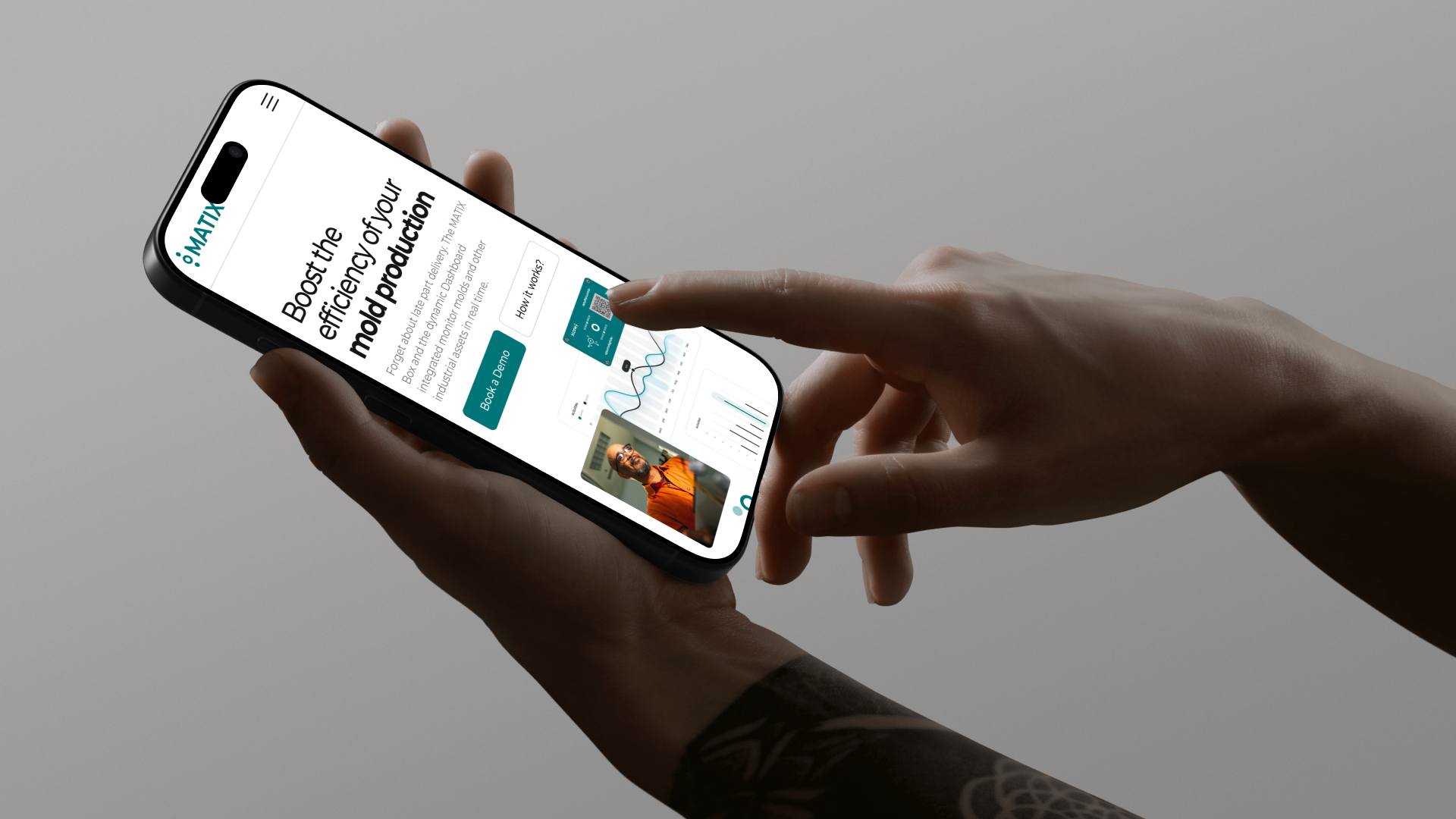 Person holding a phone showing the Matix homepage hero on mobile.
