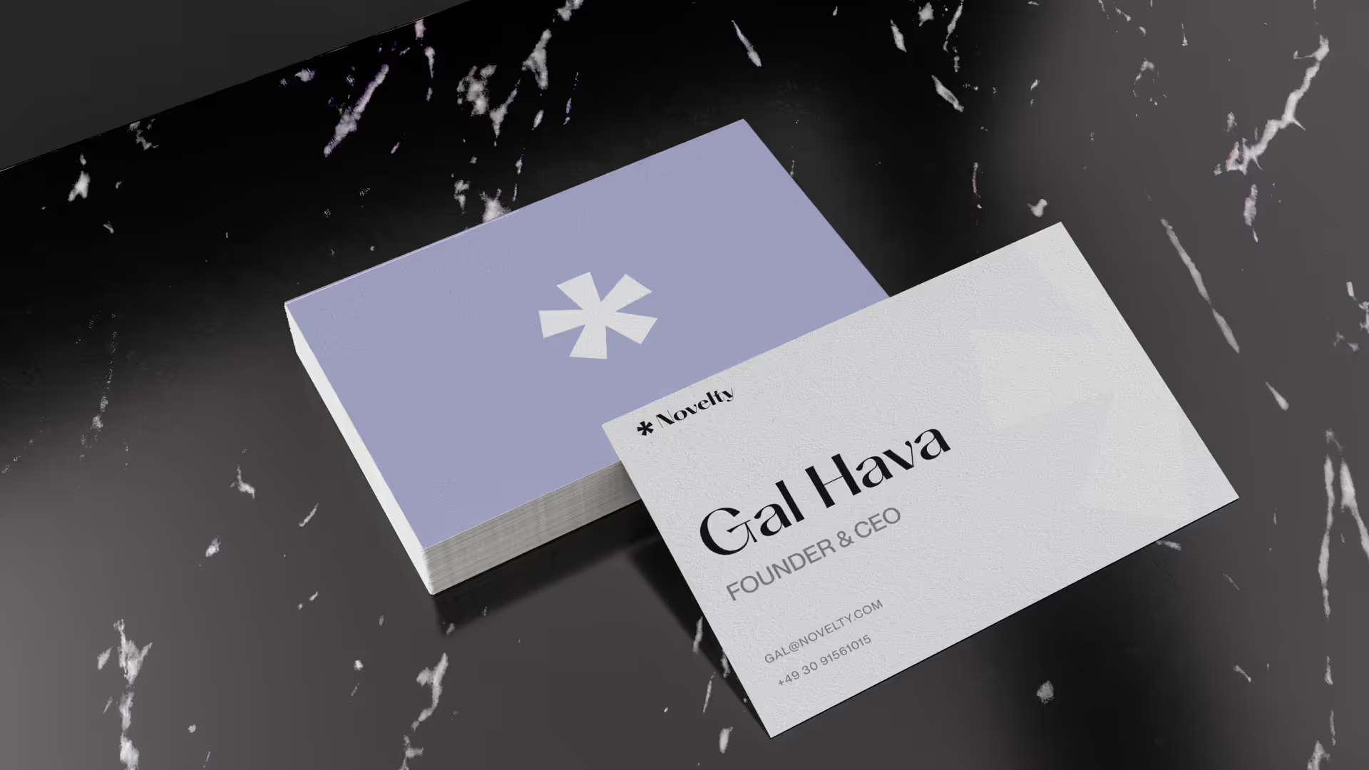 Novelty business cards designed by VX.STUDIO, featuring the brand logo and identity.