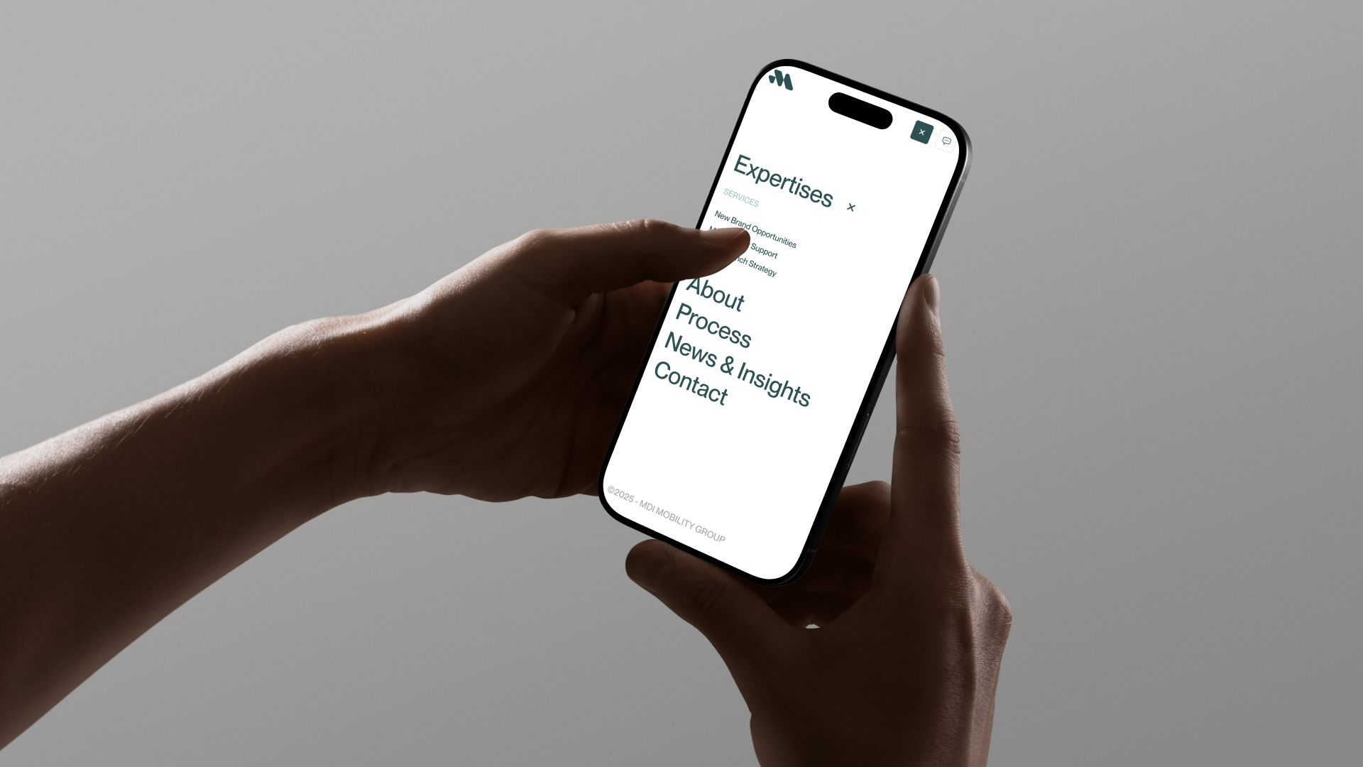 Maxwell International website on mobile, with the navigation menu open.