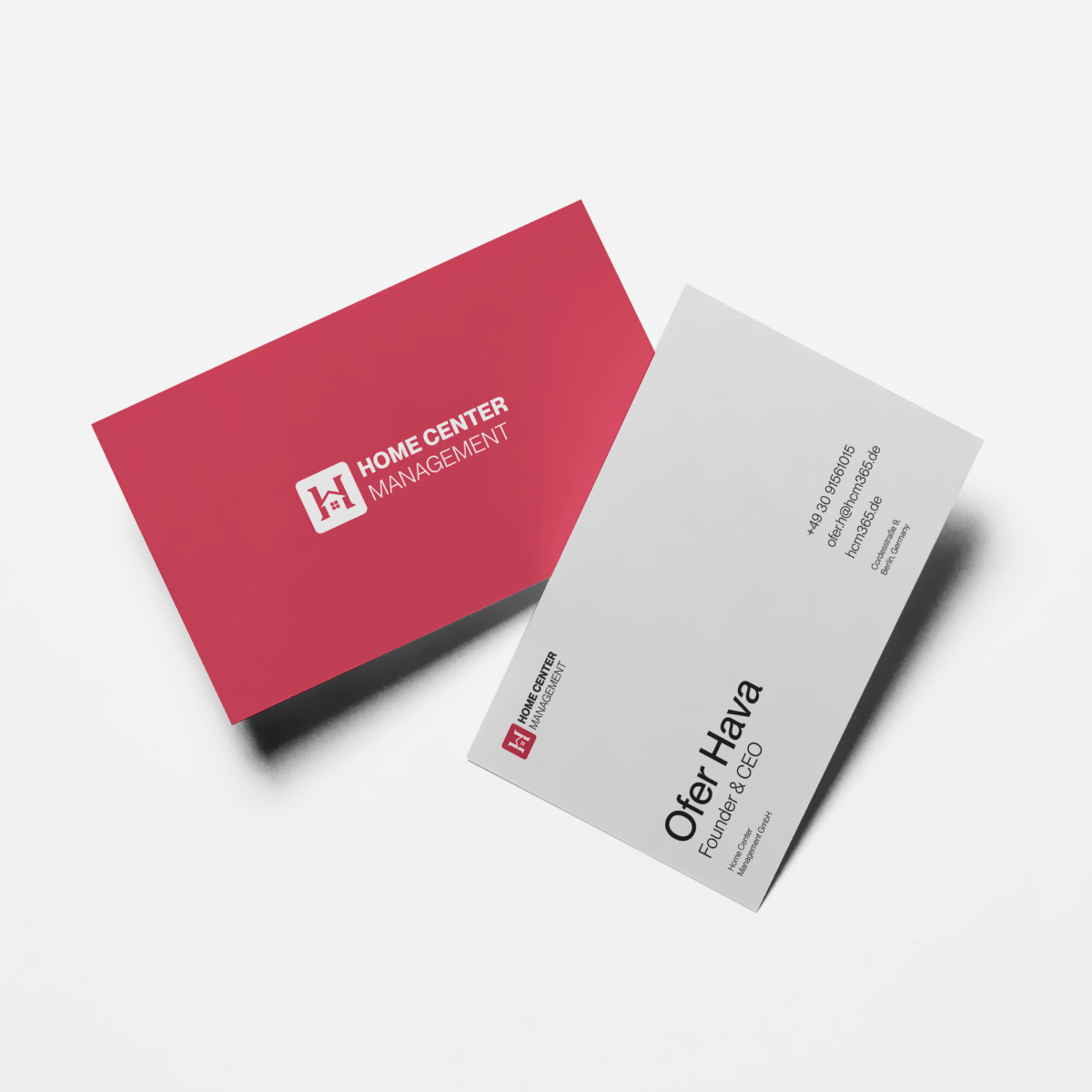 HCM business cards designed by VX.STUDIO, showing the front with the logo and the back with contact details.