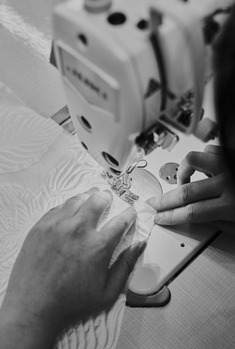 Sewing a gown detail on an industrial machine