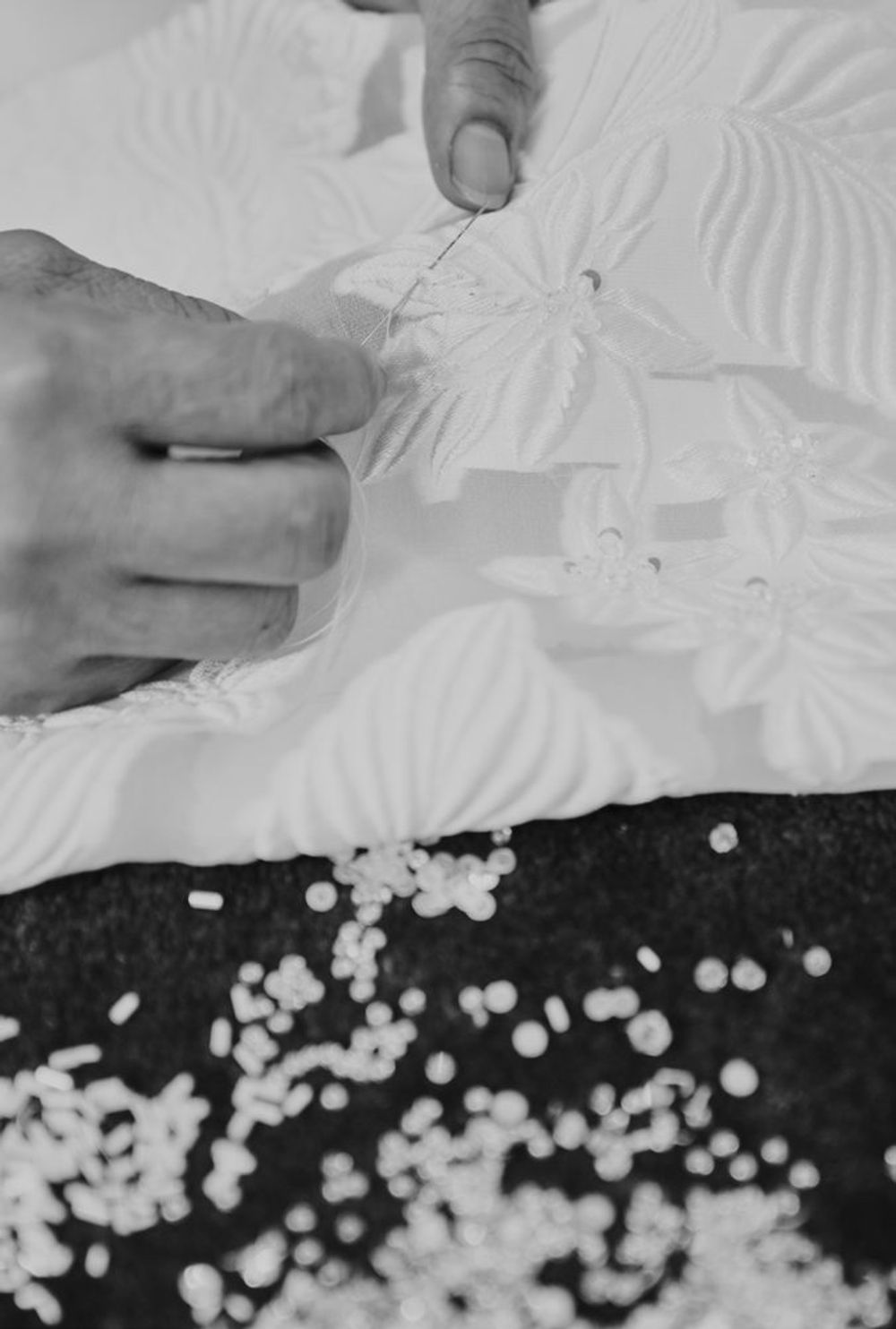 Hand beadwork and appliqué on a bridal gown