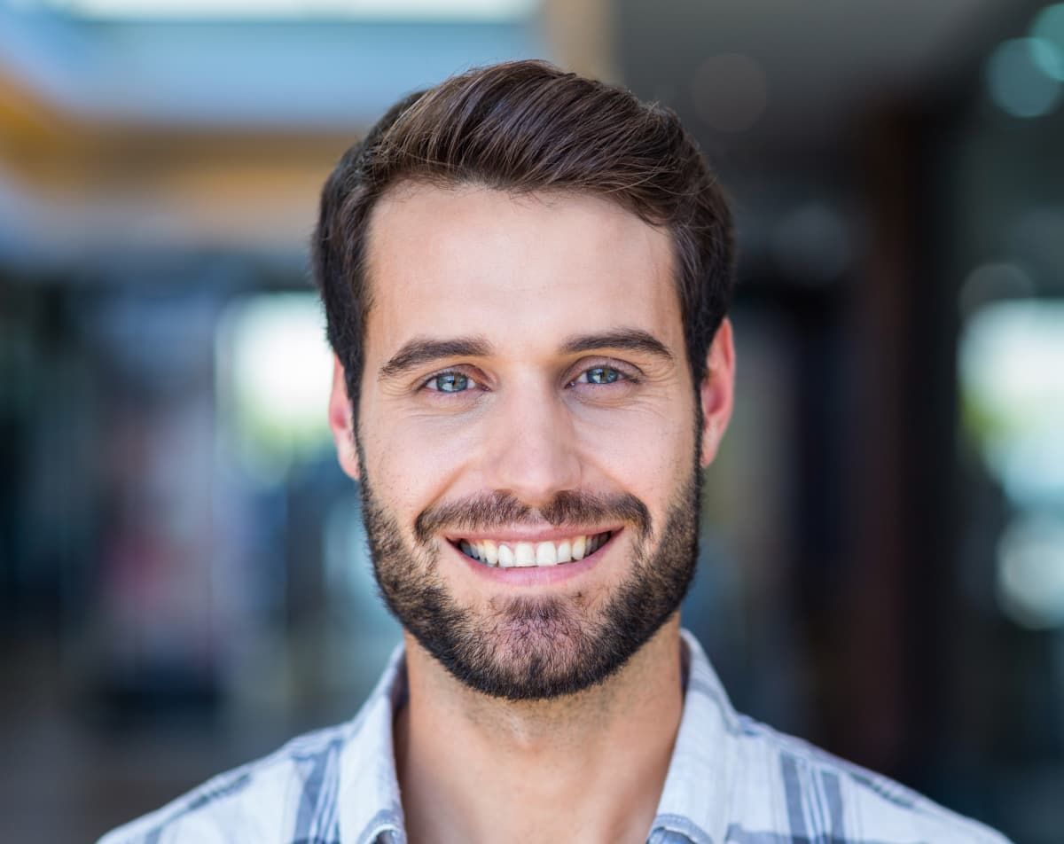 smiling guy with beard and blue eyes