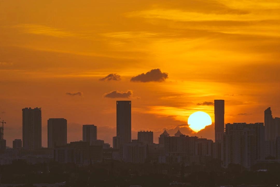 Miami skyline at sunset with modern tech buildings - app development miami