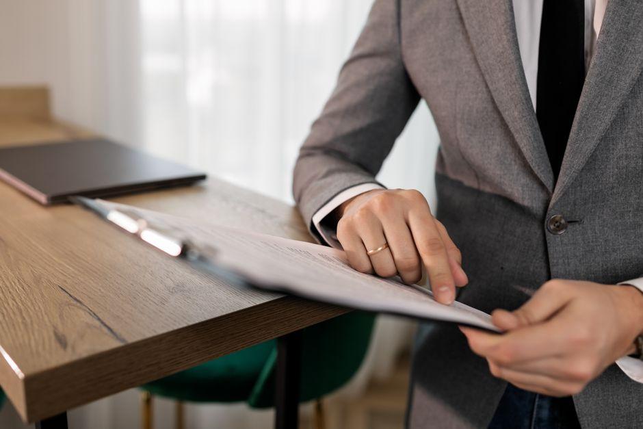 business executive reviewing a project proposal - Which is the best flutter development company for building a scalable