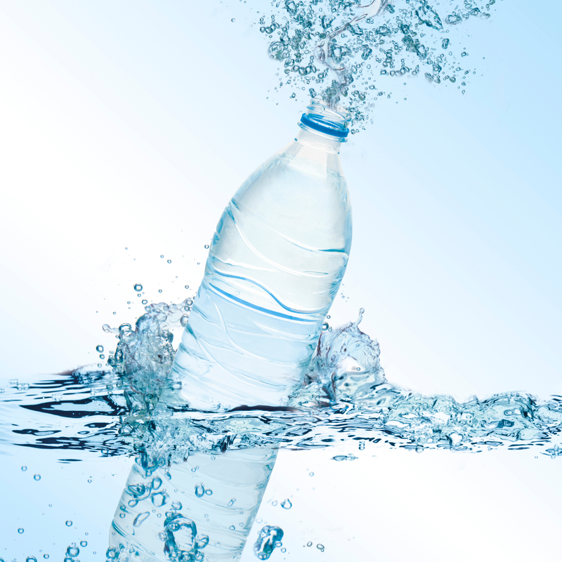 An image of water bottle splashing out water