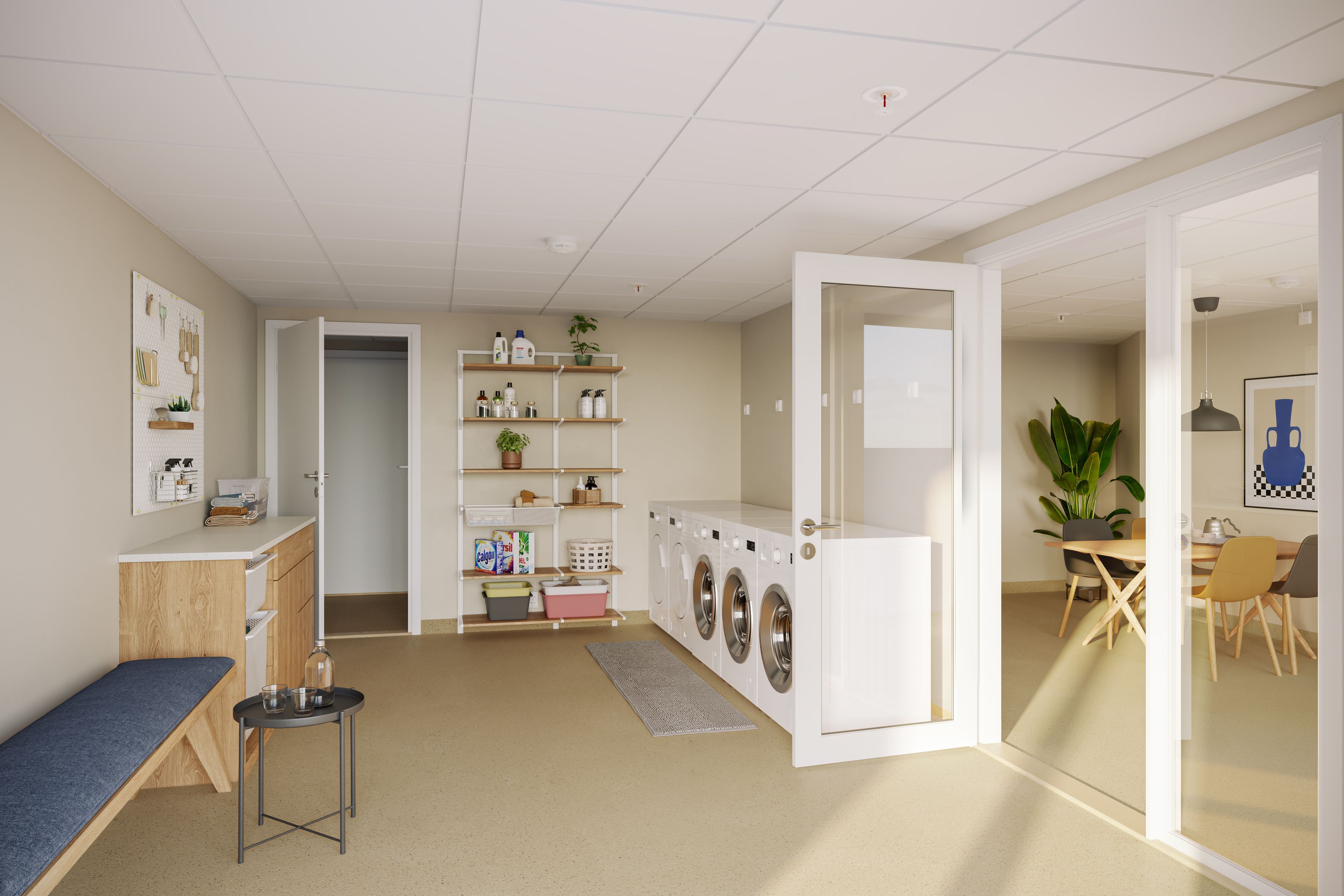 Illustrasjon av fellesvaskeriet med vaskemaskiner, sittebenk og hyller på veggen.