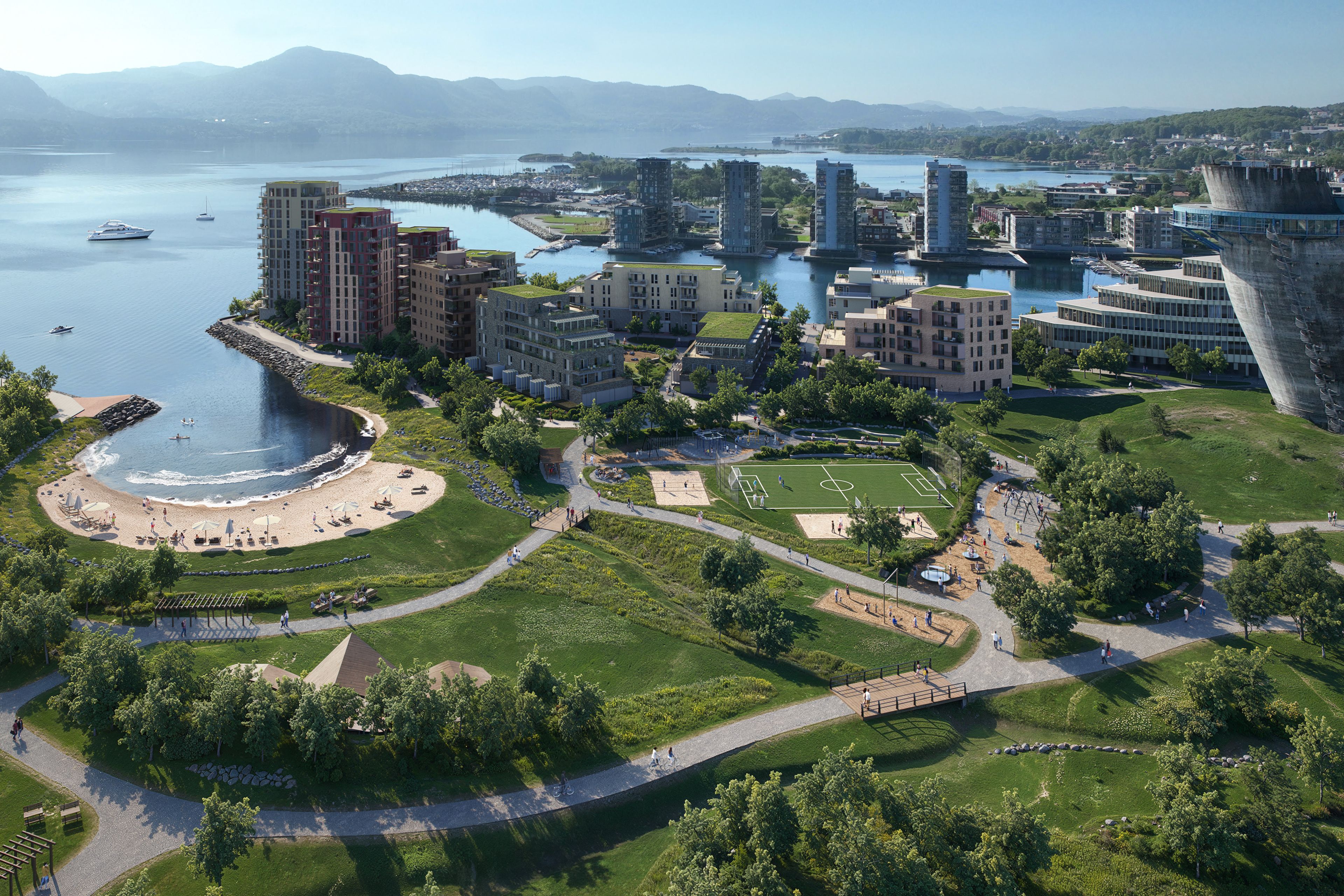 Oversiktsbilde over nabolaget med strand og grøntområder