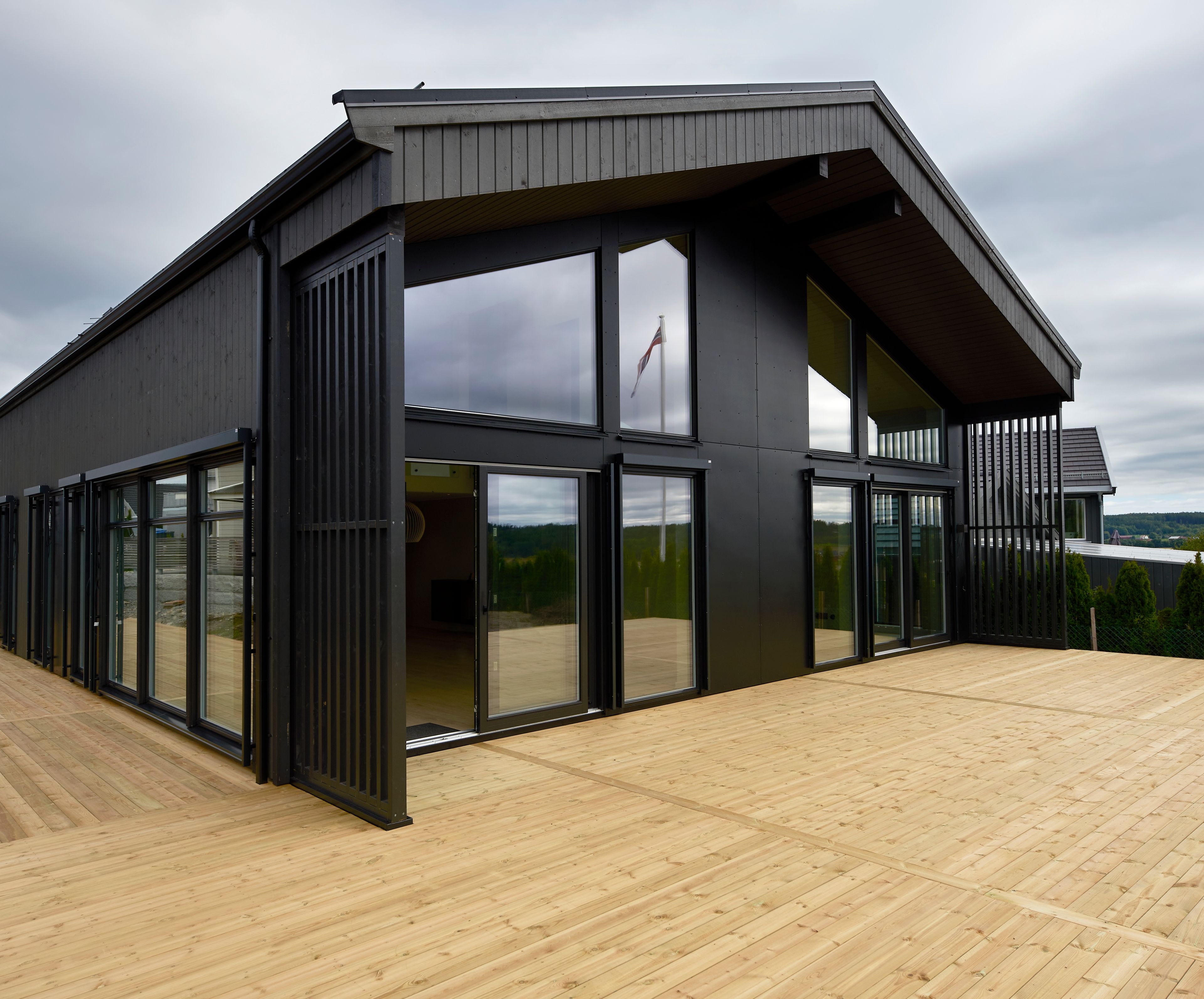 Foto av fasade på enebolig bygget av OBOS Block Watne Eneboliger, i Manstad, Fredrikstad