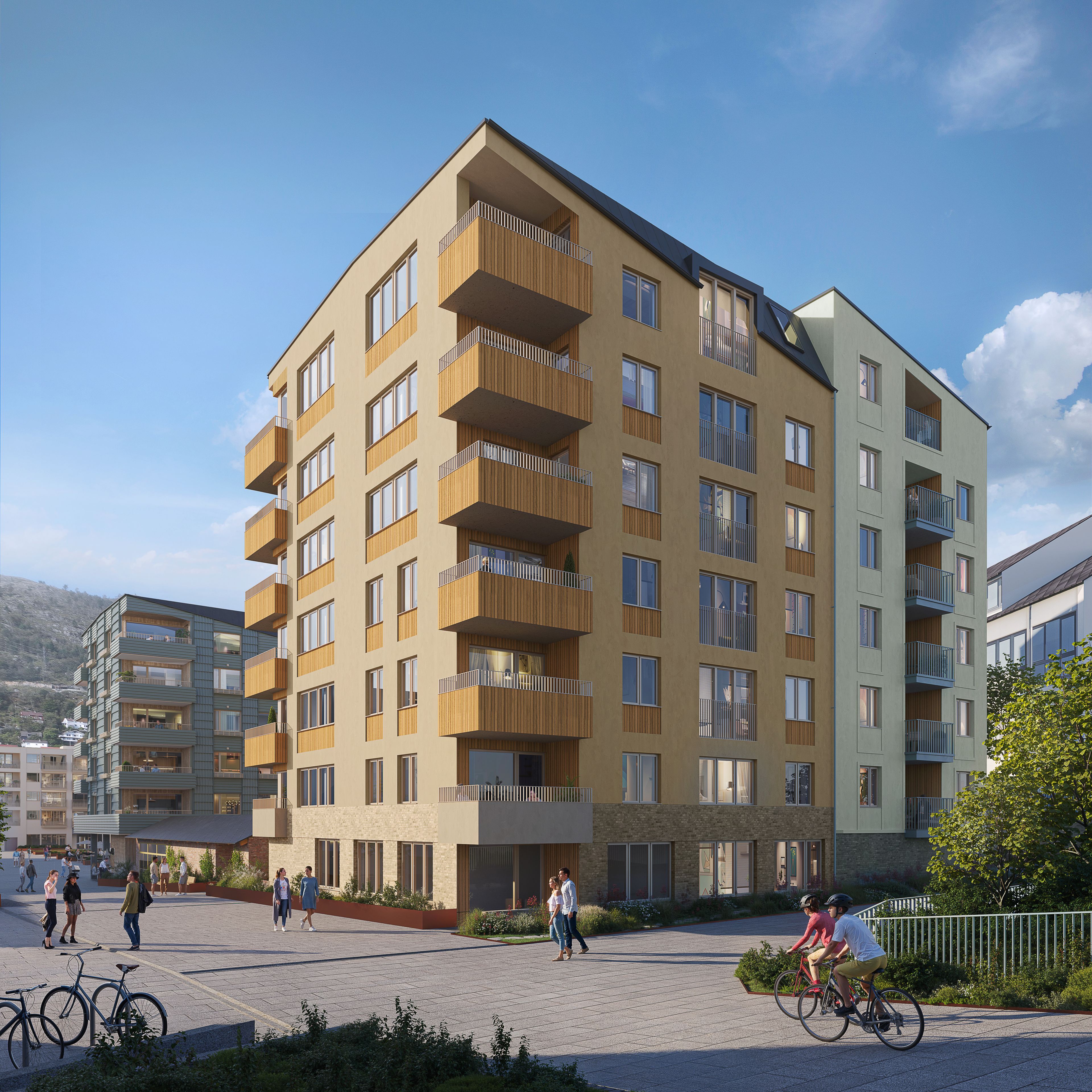 Fasade med balkonger og bilfri gang- og sykkelvei i forgrunnen.