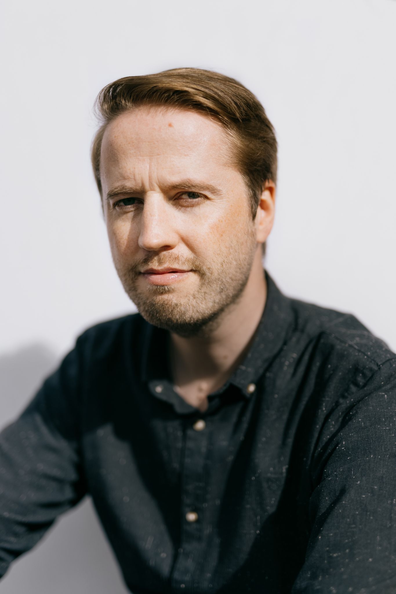 Portrettbilde av daglig leder i OBOS Living Lab Ingemund Skålnes med grønn skjorte