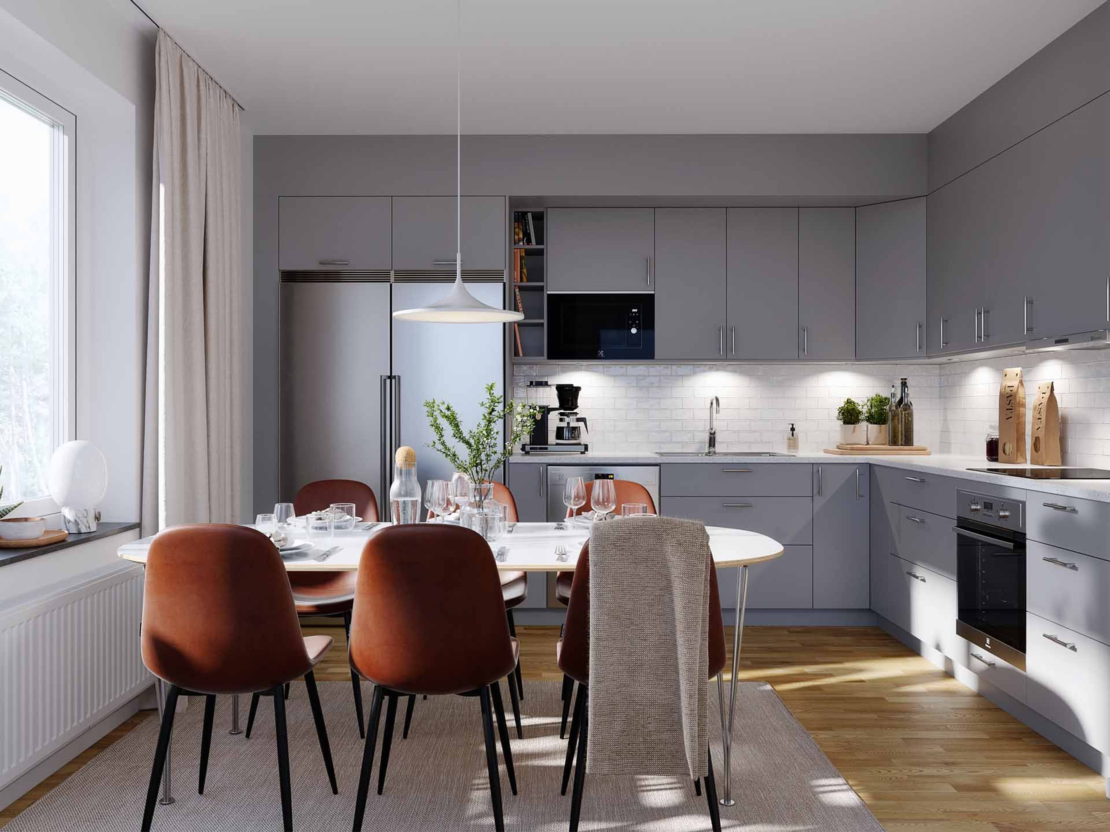 Modernt och stilrent kök, med plats för hela familjen.