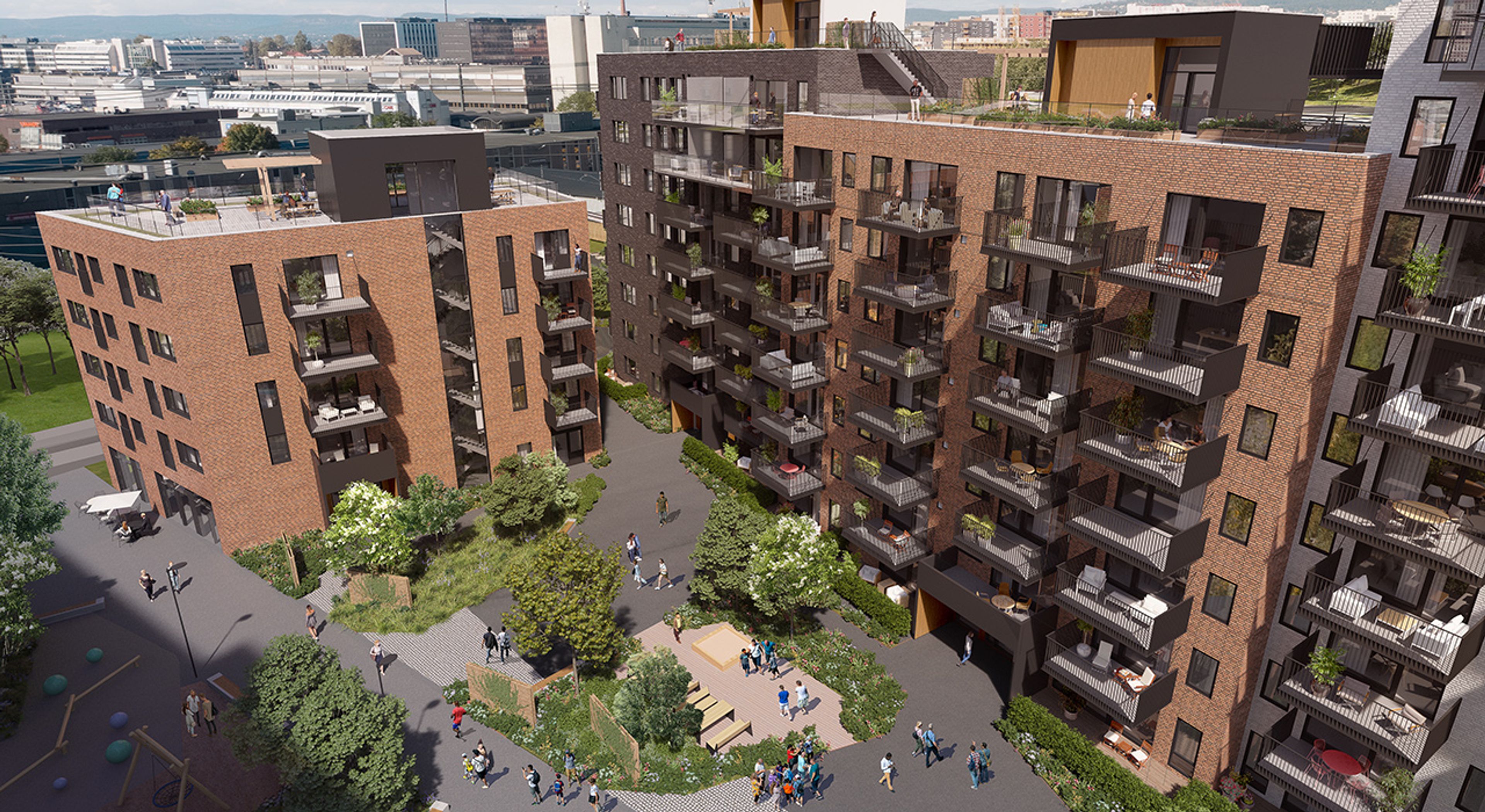 Boligblokker og et fellestorg sett fra luften