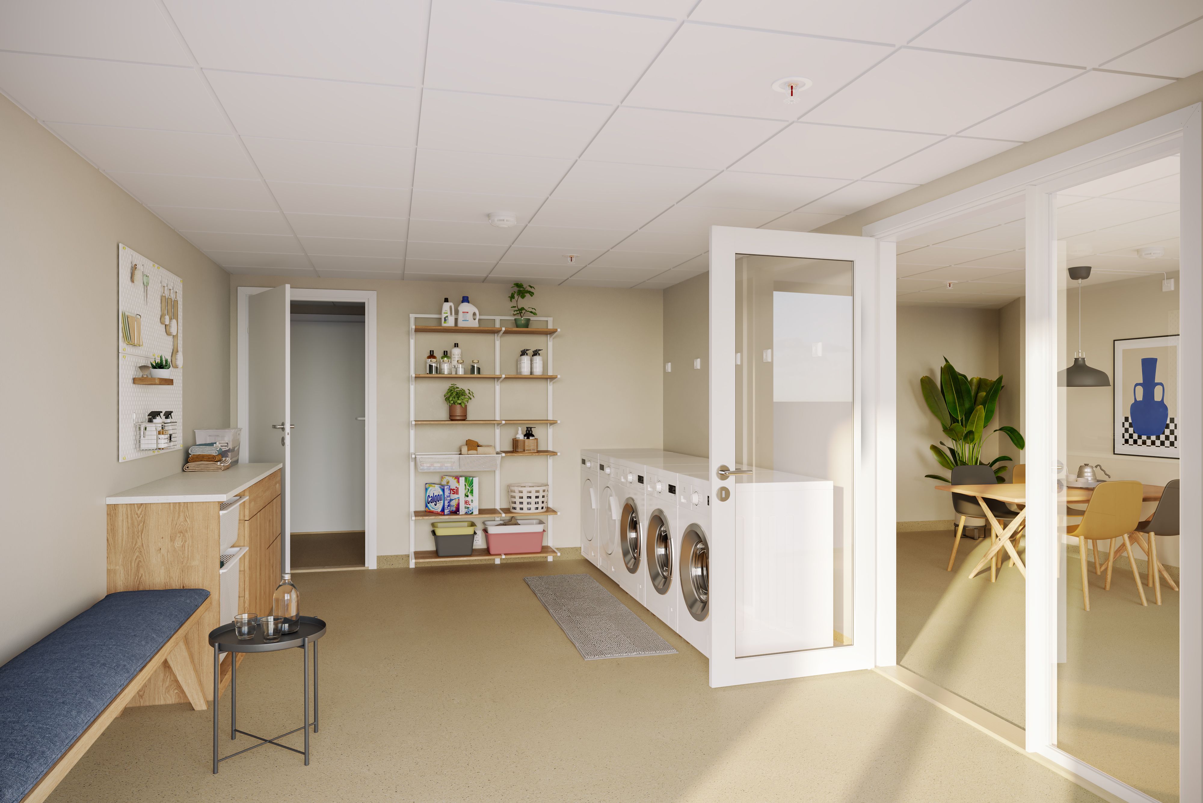 Illustrasjon av fellesvaskeriet med vaskemaskiner, sittebenk og hyller på veggen.