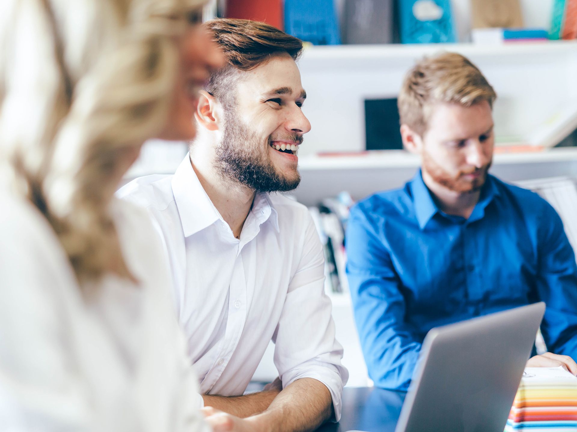 People laughing in meeting