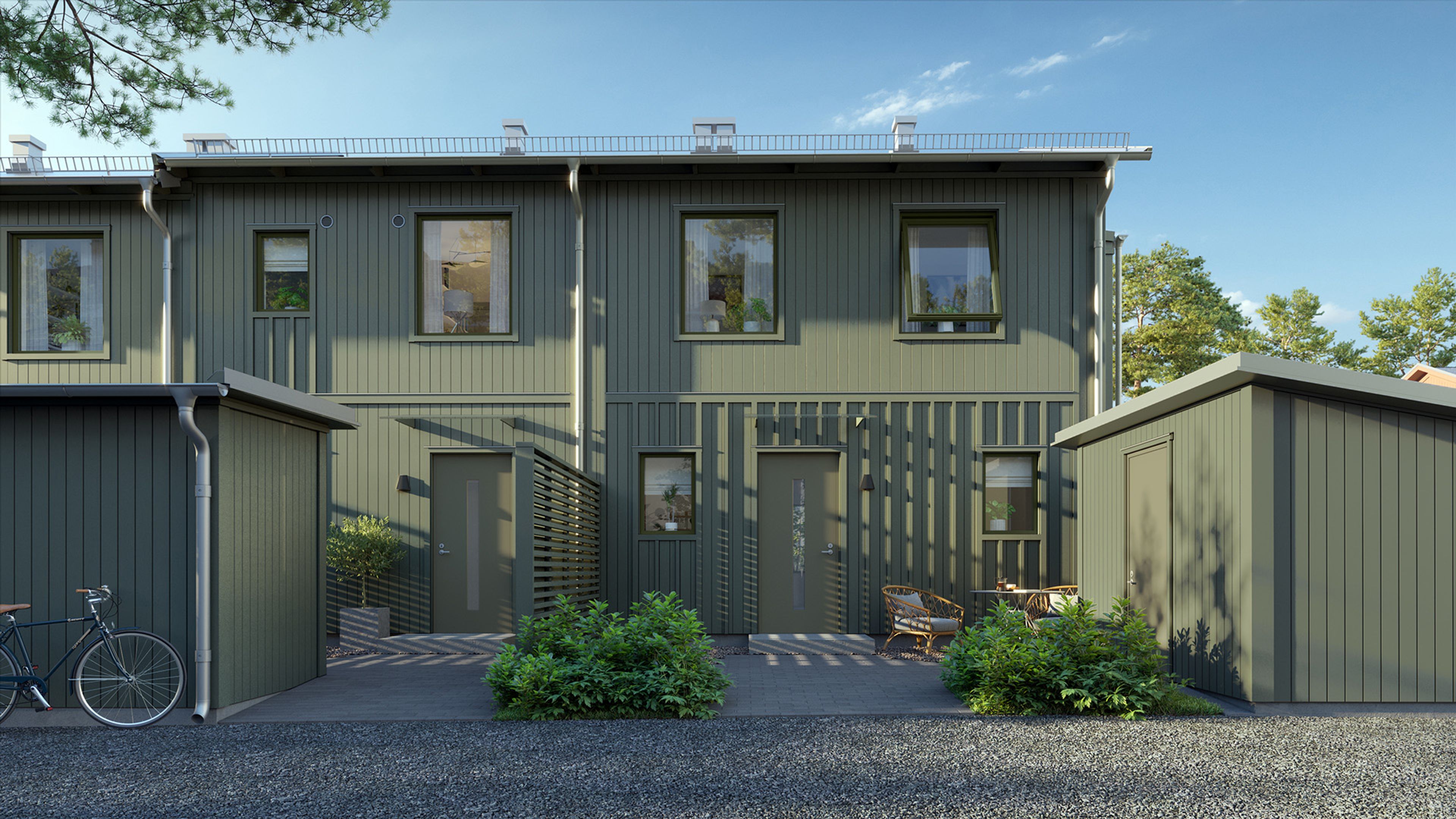 Framsida från gröna radhus i Älvdansen Wendelstrand