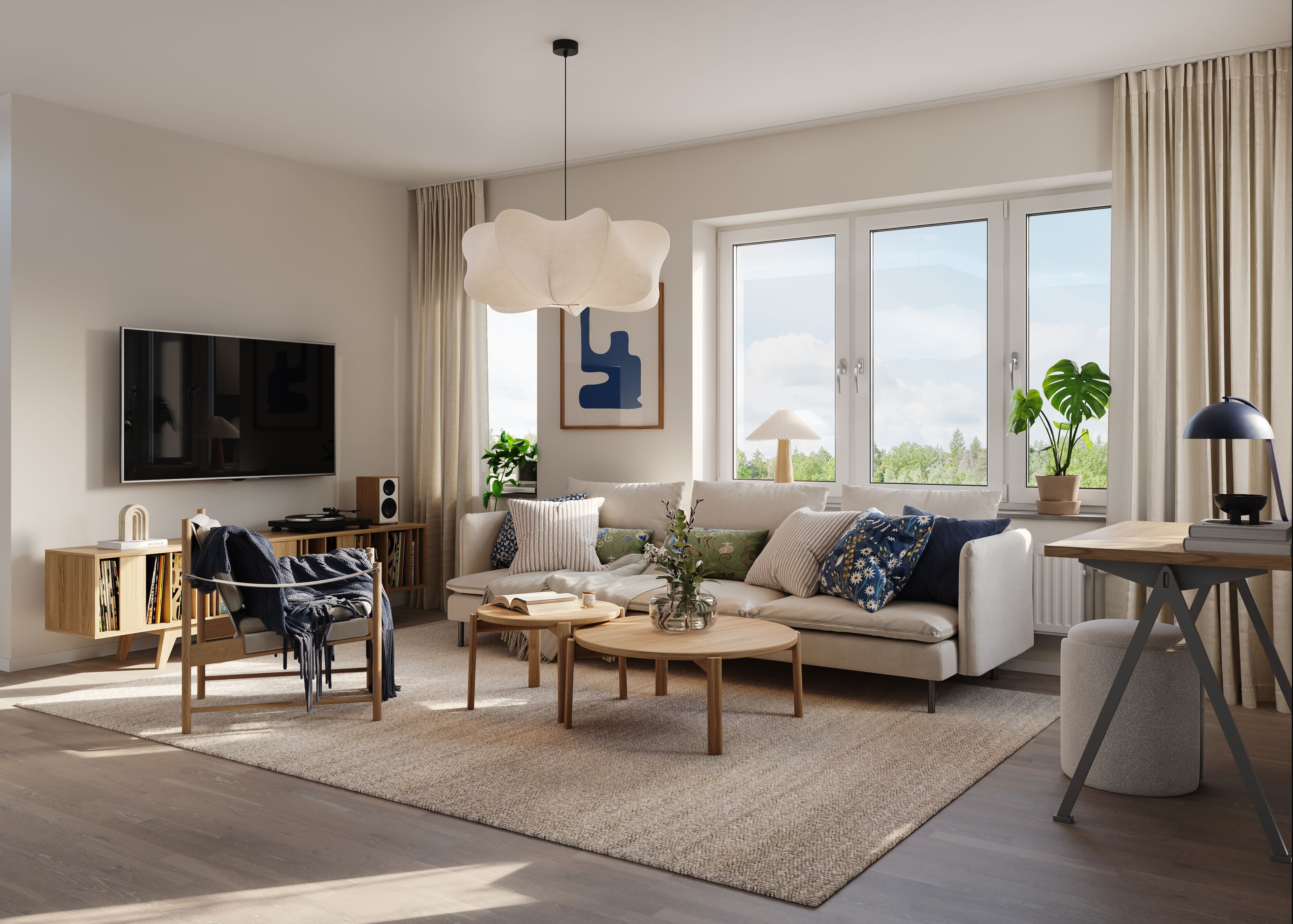 Ljust och öppet vardagsrum med soffa och tv, i beige och blå toner i en lägenhet med 4 rum och kök