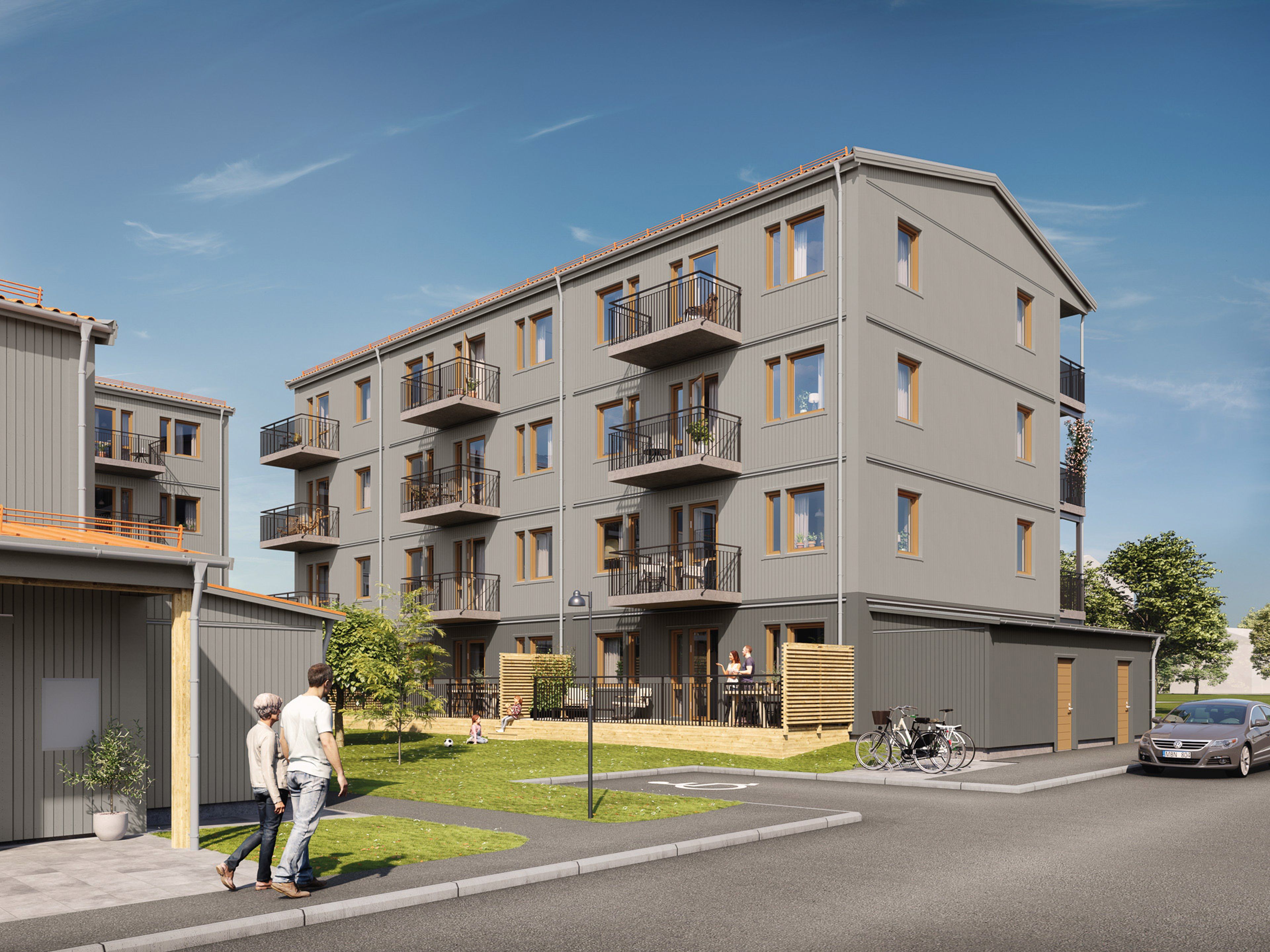 Flerfamiljshus i grått med utanpåhängande balkonger