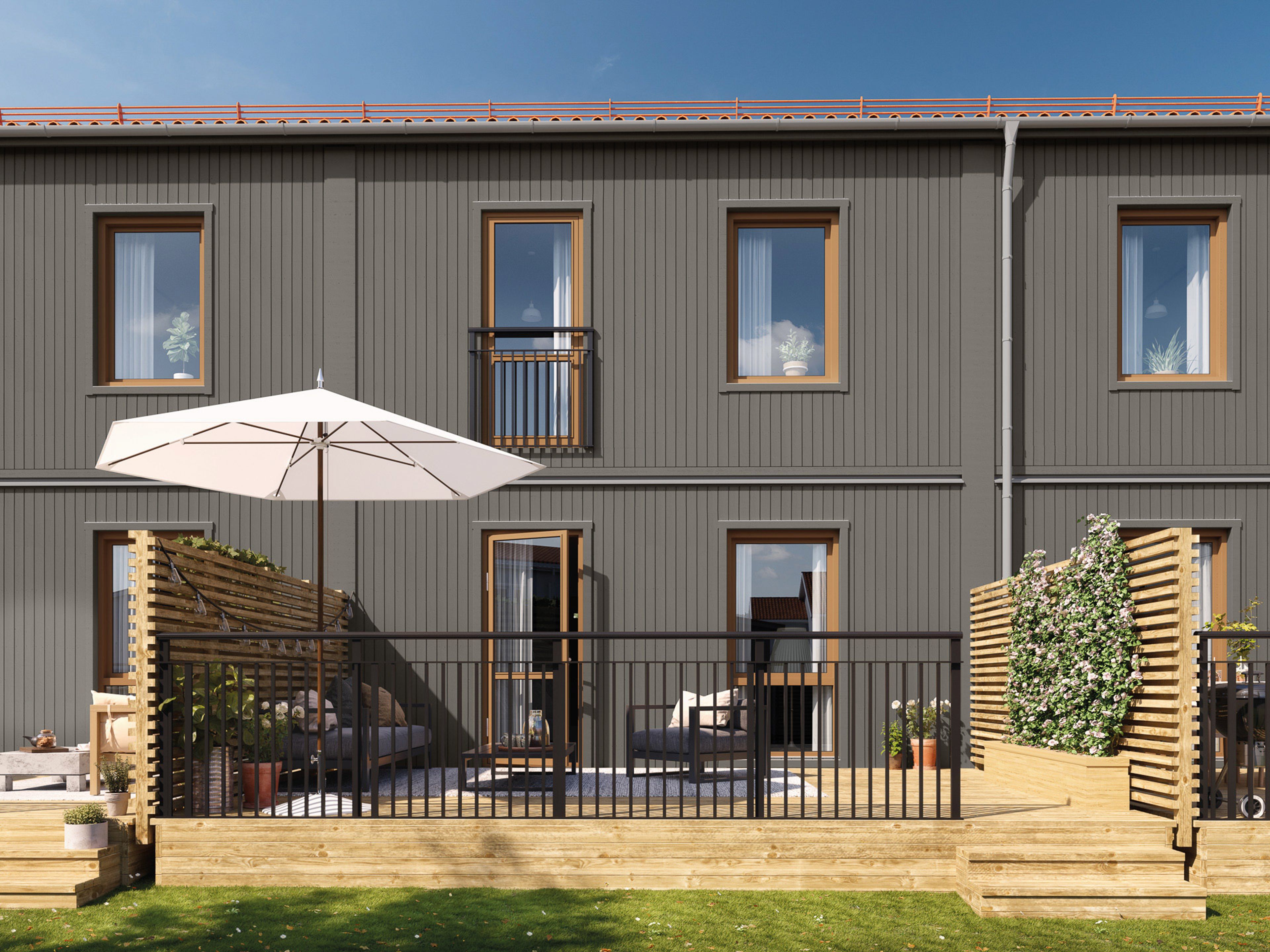 Radhus med grå träpanel