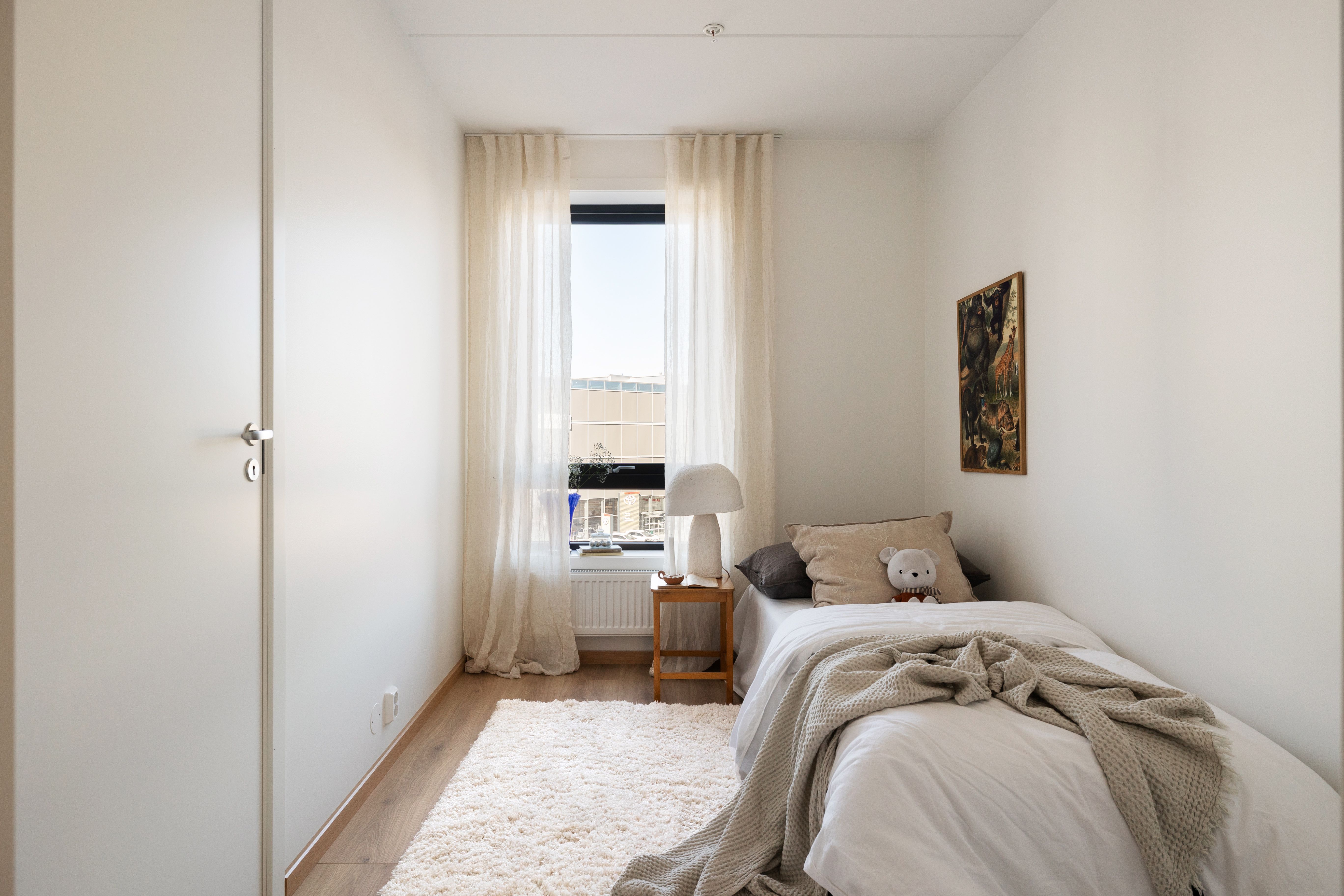 Soverom med enkeltseng i en leilighet i Ulvenkroken