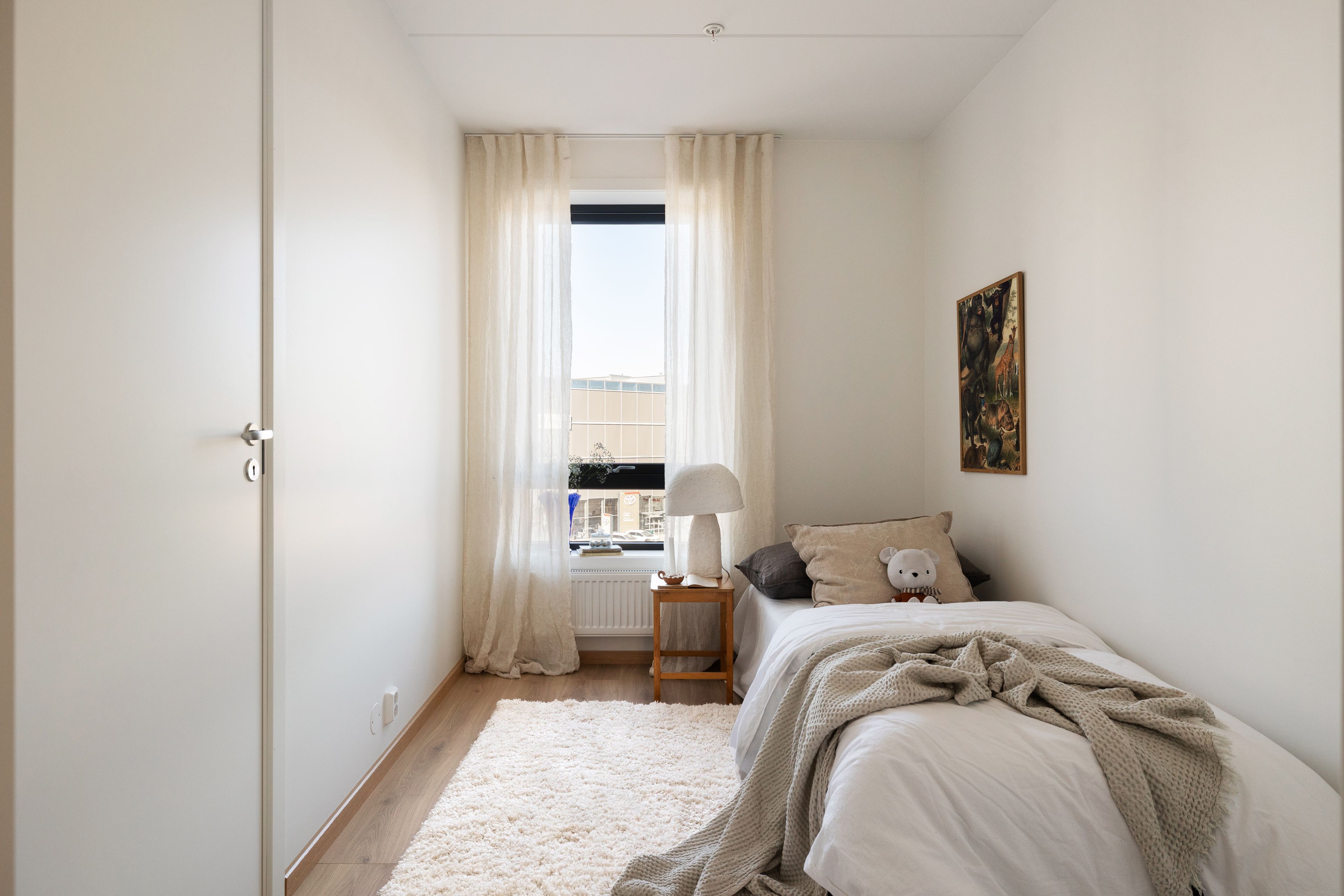 Soverom med enkeltseng i en leilighet i Ulvenkroken
