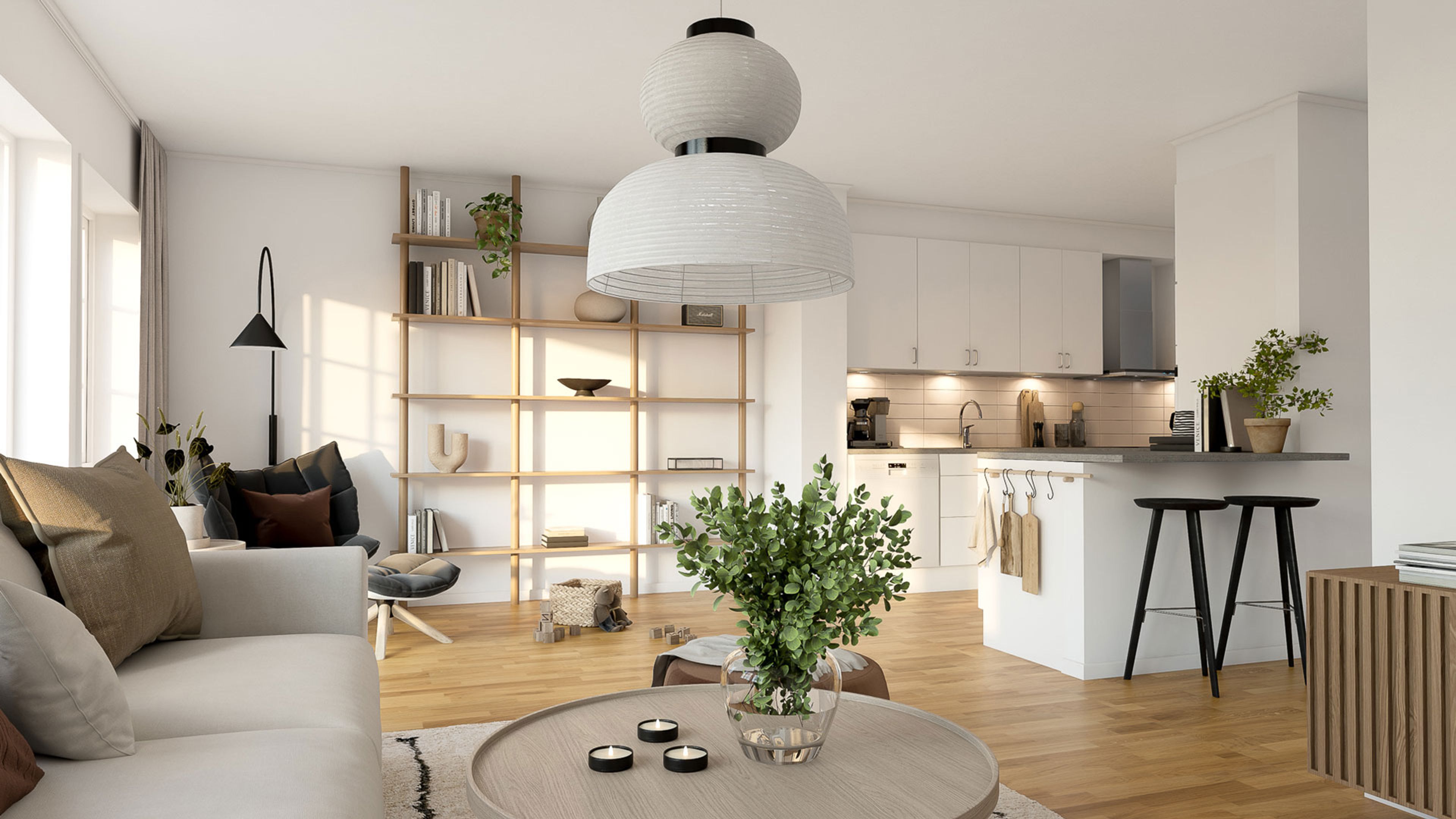 öppen planlösning med kök och vardagsrum