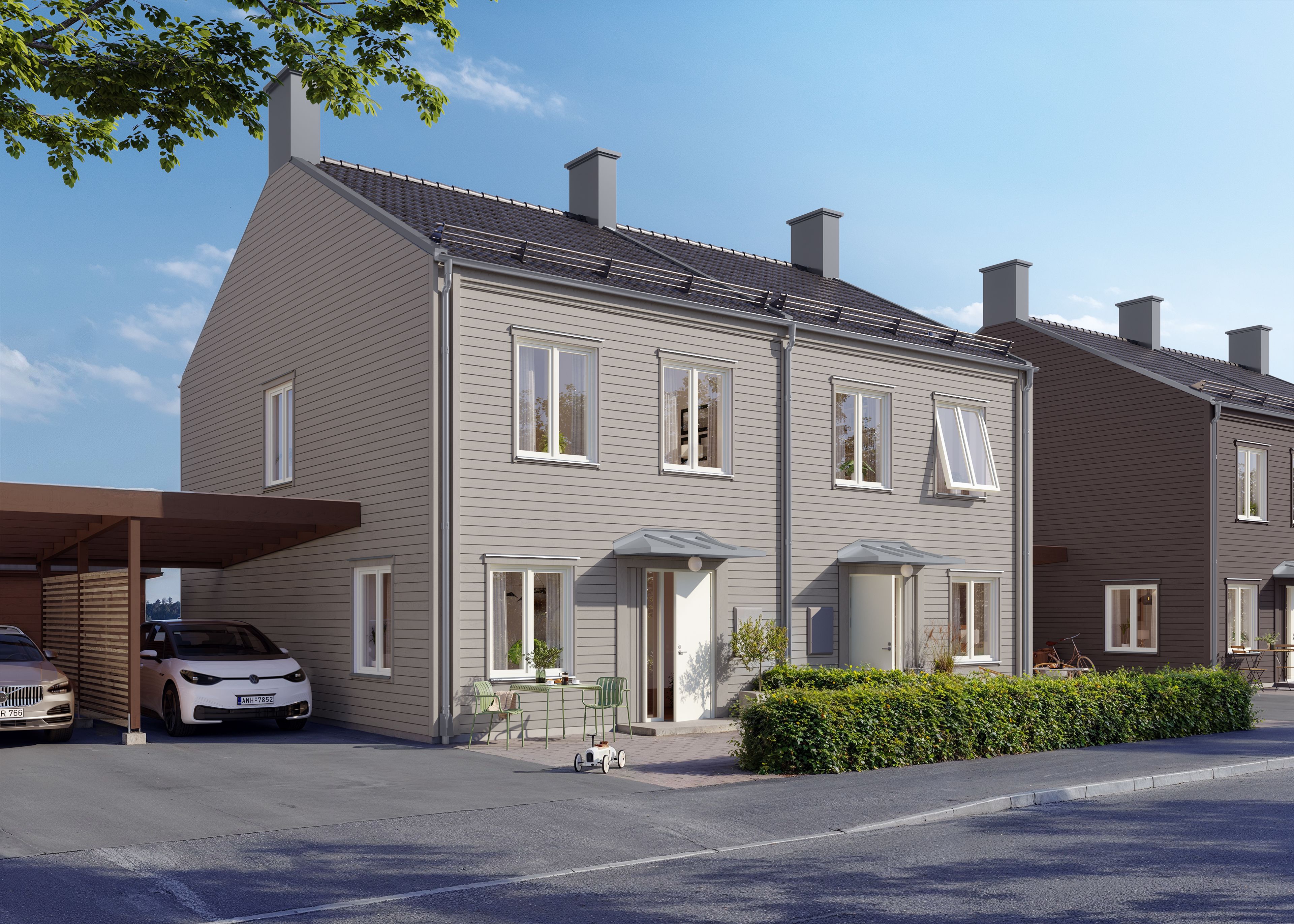 Exteriör bild på framsida av beige parhus med carport vid sidan
