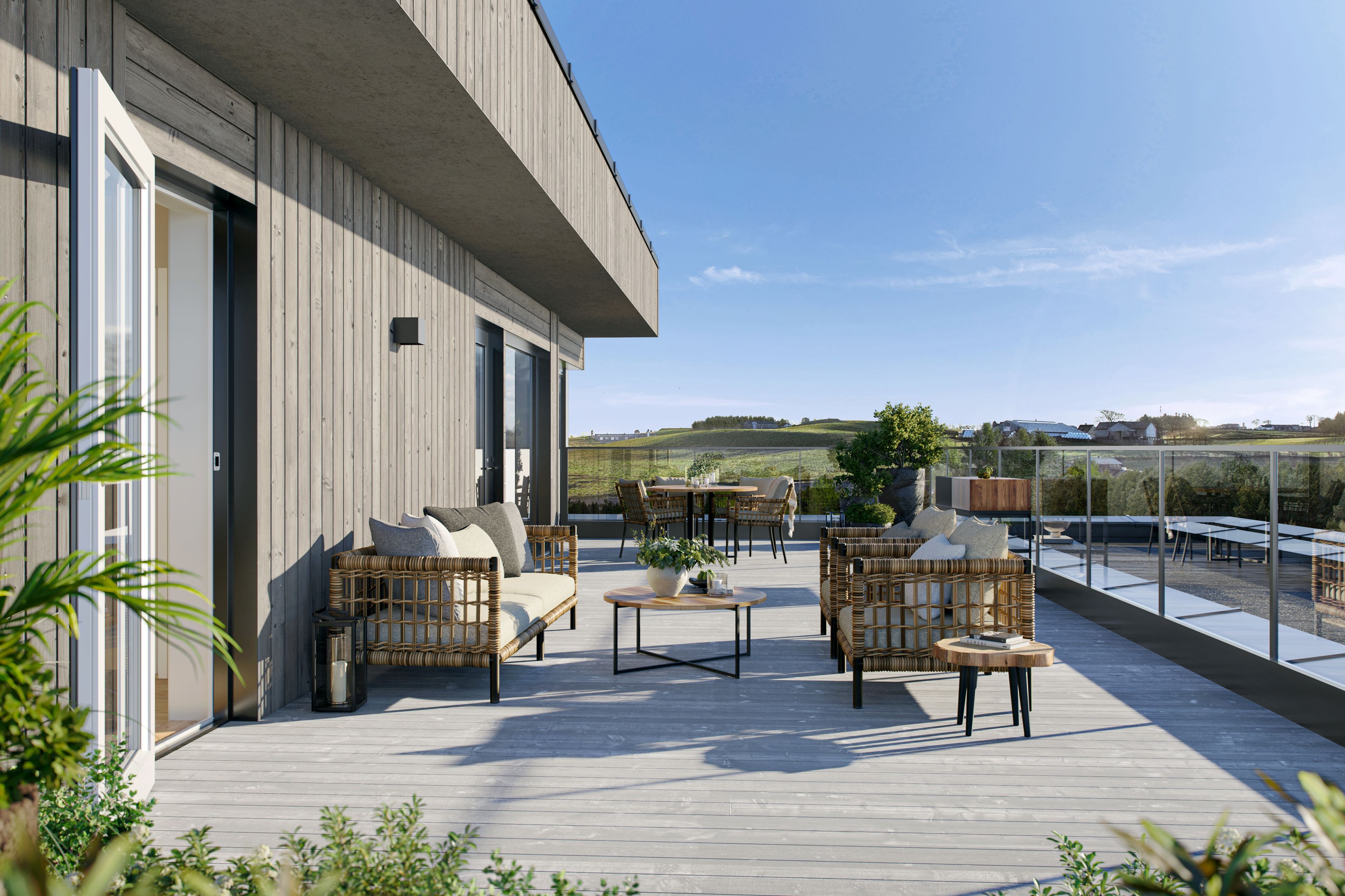 Illustrasjon av terrasse i fireromsleilighet i boligprosjektet Stasjonshøyden.