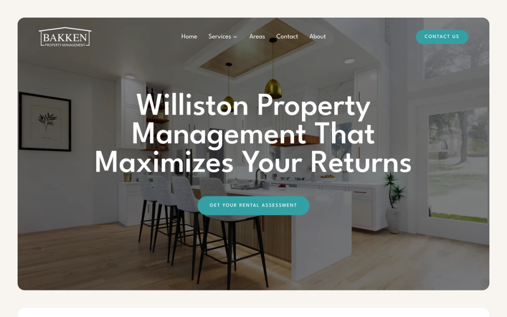 The Bakken Property Management homepage, showing a bright modern rental kitchen.