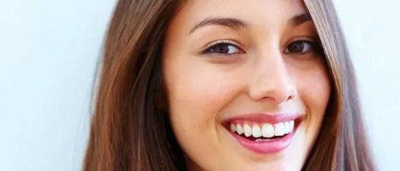 Smiling woman with long brown hair