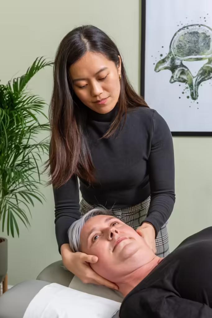 A chiropractor treating a patient at the Burton-on-Trent clinic