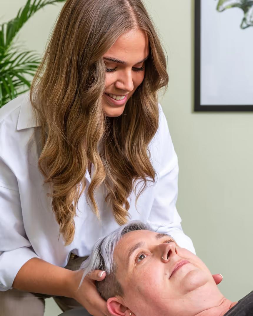 A chiropractor working with a patient at the clinic