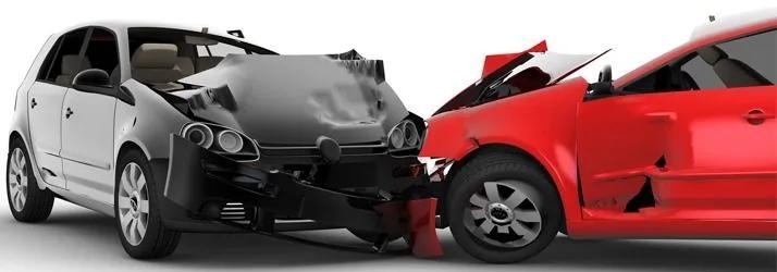 Head-on collision between a white car and a red car