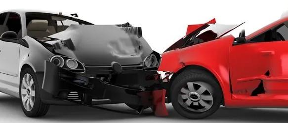 Head-on collision between a white car and a red car