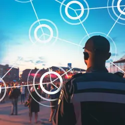 A security person standing and watching crowd