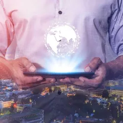 A neck high image of a man holding a tablet