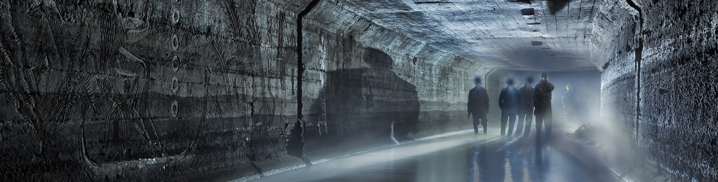 A group of people walking through a tunnel